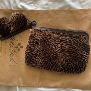 Patricia Nash sheepskin and leather wristlet with Pom poms